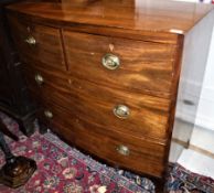 An early 19th Century mahogany bow fronted chest of two long graduated drawers on splayed bracket