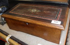 A 19th Century Swiss simulated rosewood cased musical box.