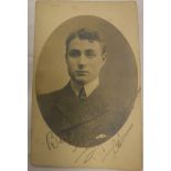 A photograph of the young Charlie Chaplin circa 1903-1905 inscribed "Best wishes Charles Chaplin",