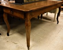 An early 19th Century French fruit wood farm house kitchen table the plank top with cleated ends