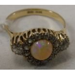 An 18 carat gold opal and diamond set ring, size P, total weight approx 4.