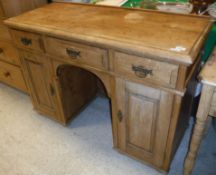 A pine pedestal sideboard with three frieze drawers over two cupboard doors Size approx.