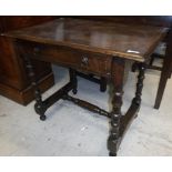 WITHDRAWN - An oak single drawer side table in the circa 1700 manner raised on turned and ringed