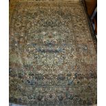 An Isfahan rug the central panel with all over floral decoration on a cream ground within a salmon