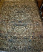 An Isfahan rug the central panel with all over floral decoration on a cream ground within a salmon