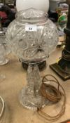 An early 20th Century cut glass lamp 46cm tall