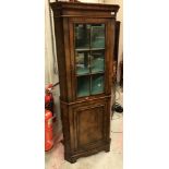 A 20th Century walnut veneered free-standing corner cupboard in the 18th Century manner,