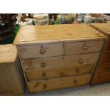 A pine chest of two short over three long graduted drawers together with a small oak two door