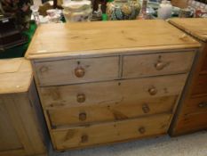 A pine chest of two short over three long graduted drawers together with a small oak two door