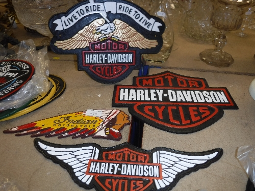 A collection of four reproduction "vintage" American motorcycle signs including "Indian Motorcycle",