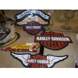 A collection of four reproduction "vintage" American motorcycle signs including "Indian Motorcycle",