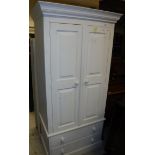 A modern painted pine two door wardrobe with two drawers below,