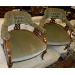A pair of stained beech framed Edwardian salon tub chairs Size approx.