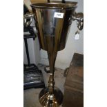 A polished metal floor standing wine cooler inscribed "Brunello Cantina Chiani Classico" Size