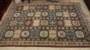 A Persian style rug,