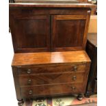 A 19th Century American mahogany bureau bookcase with secret compartment over the canted recess and