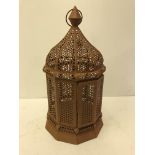 A Moroccan style pierced metal dome top lantern