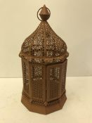 A Moroccan style pierced metal dome top lantern