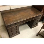 A Victorian oak double pedestal desk of typical form,