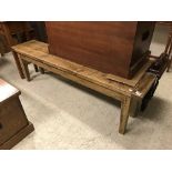 A waxed and stained pine bench seat in the French taste,
