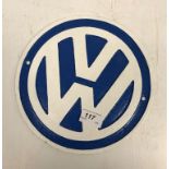 A modern painted cast metal sign "VW"