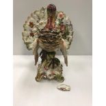 A 19th century french pottery turkey figure with floral decoration in the manner of Delphin Massier.