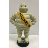A modern painted cast metal figure of the Michelin Man inscribed "Michelin Detroit Reg 1918"
