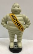 A modern painted cast metal figure of the Michelin Man inscribed "Michelin Detroit Reg 1918"