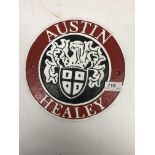 A modern painted cast metal sign "Austin Healey"