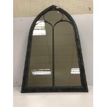 A painted metal framed Gothic arch wall mirror 59 cm wide x 114 cm high