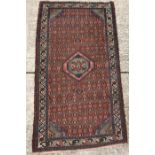 A Caucasian rug with central lozenge shape medallion on a lozenge medallion decorated ground,