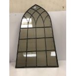 A painted metal framed Gothic arch wall mirror 52 cm wide x 115.