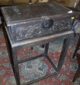A 17th Century oak Bible box, the top with moulded decoration and iron hinges and clasp,