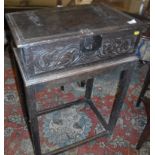 A 17th Century oak Bible box, the top with moulded decoration and iron hinges and clasp,