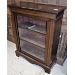 An Edwardian mahogany and satinwood banded side cabinet with single glazed door enclosing shelving,