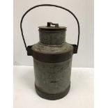 A vintage style galvanised and studded steel milk churn