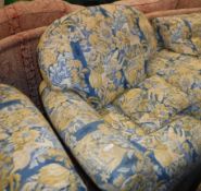 A modern blue, yellow and cream upholstered scroll arm four piece living room suite comprising sofa,