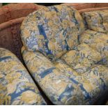 A modern blue, yellow and cream upholstered scroll arm four piece living room suite comprising sofa,