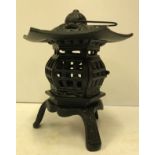 A cast iron pagoda tealight holder