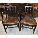 A set of seven Hepplewhite style mahogany framed dining chairs with leather seats (6 + 1 carver)