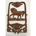 A cast iron ornament as a Victorian horse stable door panel