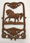 A cast iron ornament as a Victorian horse stable door panel