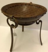 A modern cast iron fire pit on stand, 41.