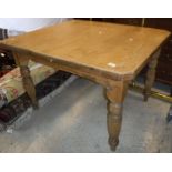 A Victorian pine kitchen table on ringed and reeded legs,