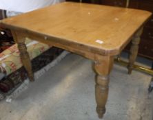 A Victorian pine kitchen table on ringed and reeded legs,