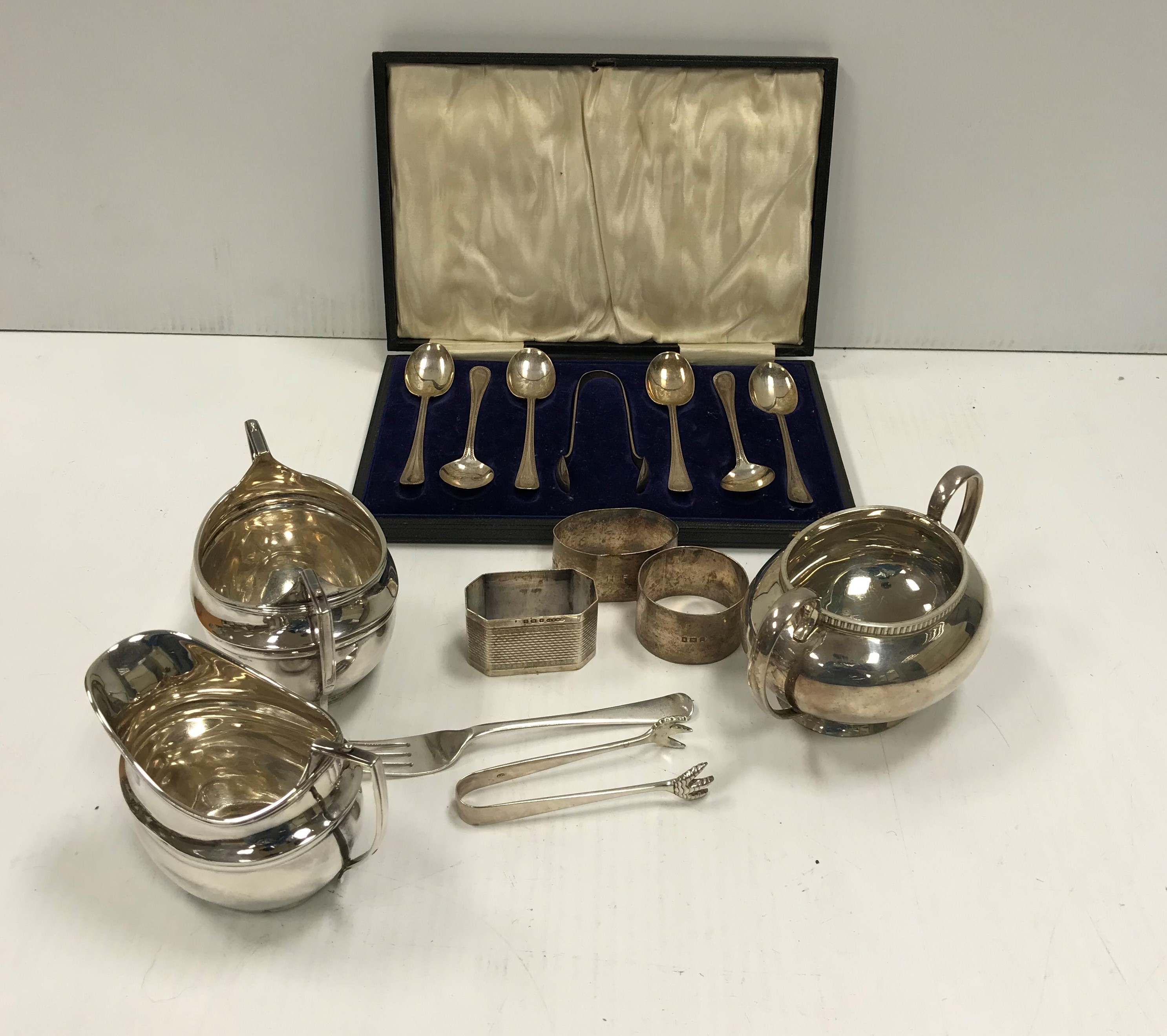 A collection of silver wares comprising a cased set of six silver teaspoons and sugar tongs, - Image 2 of 2