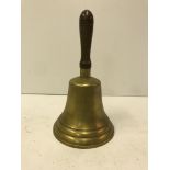 A wooden handled brass school type bell