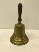 A wooden handled brass school type bell