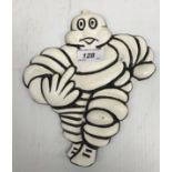 A modern painted cast metal sign "Michelin Man / Up Yours"