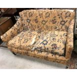 A circa 1900 upholstered two seat sofa,